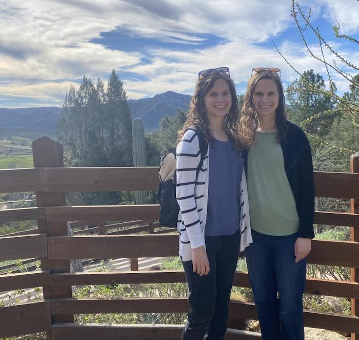 Hallie and her twin sister in San Diego